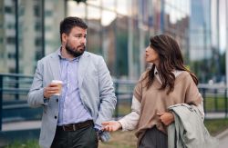 two coworkers in serious conversation