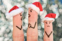 fingers wearing santa hats